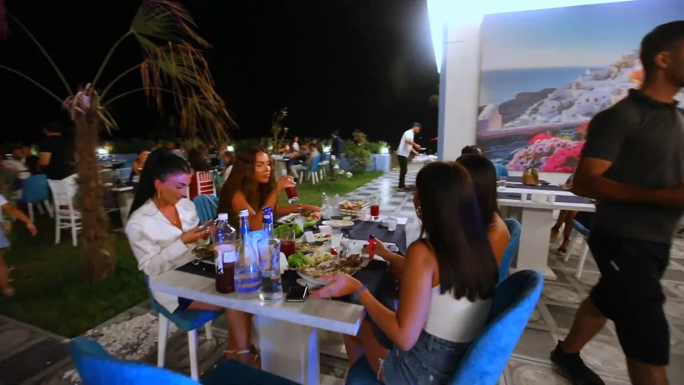 Dinner on the lawn by the painted wall