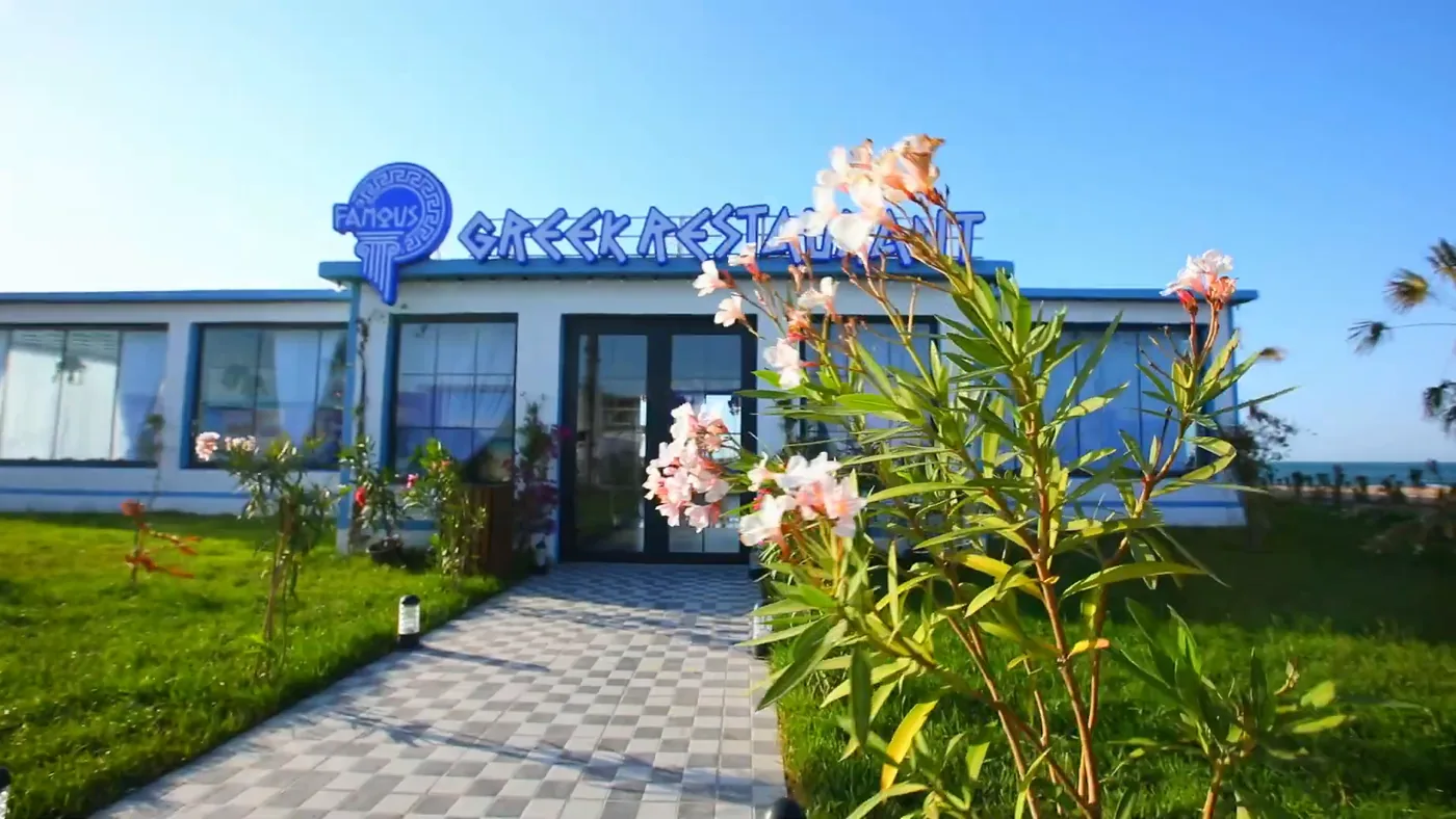 The entrance among blooming oleanders