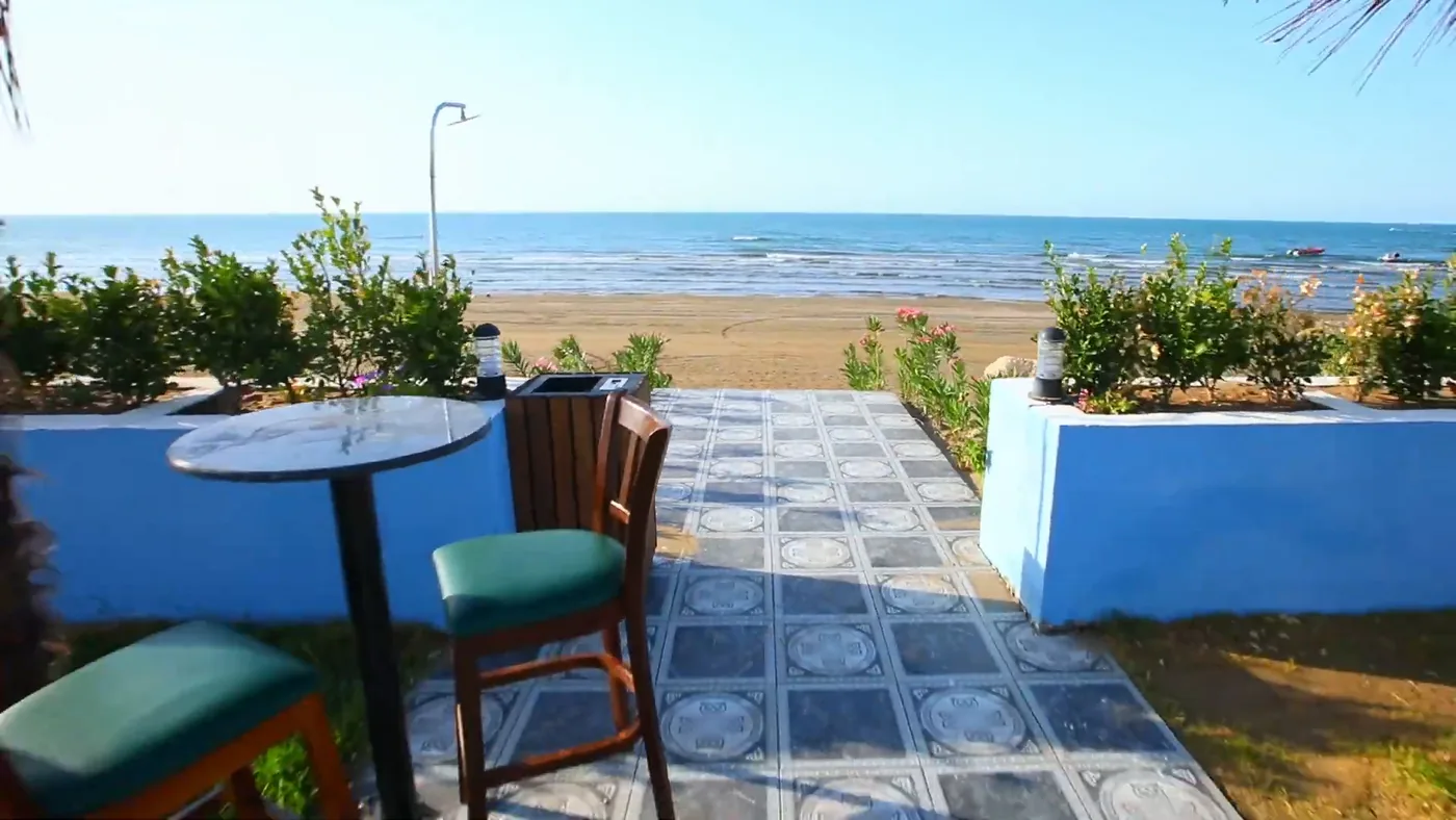 A bar table right by the beach